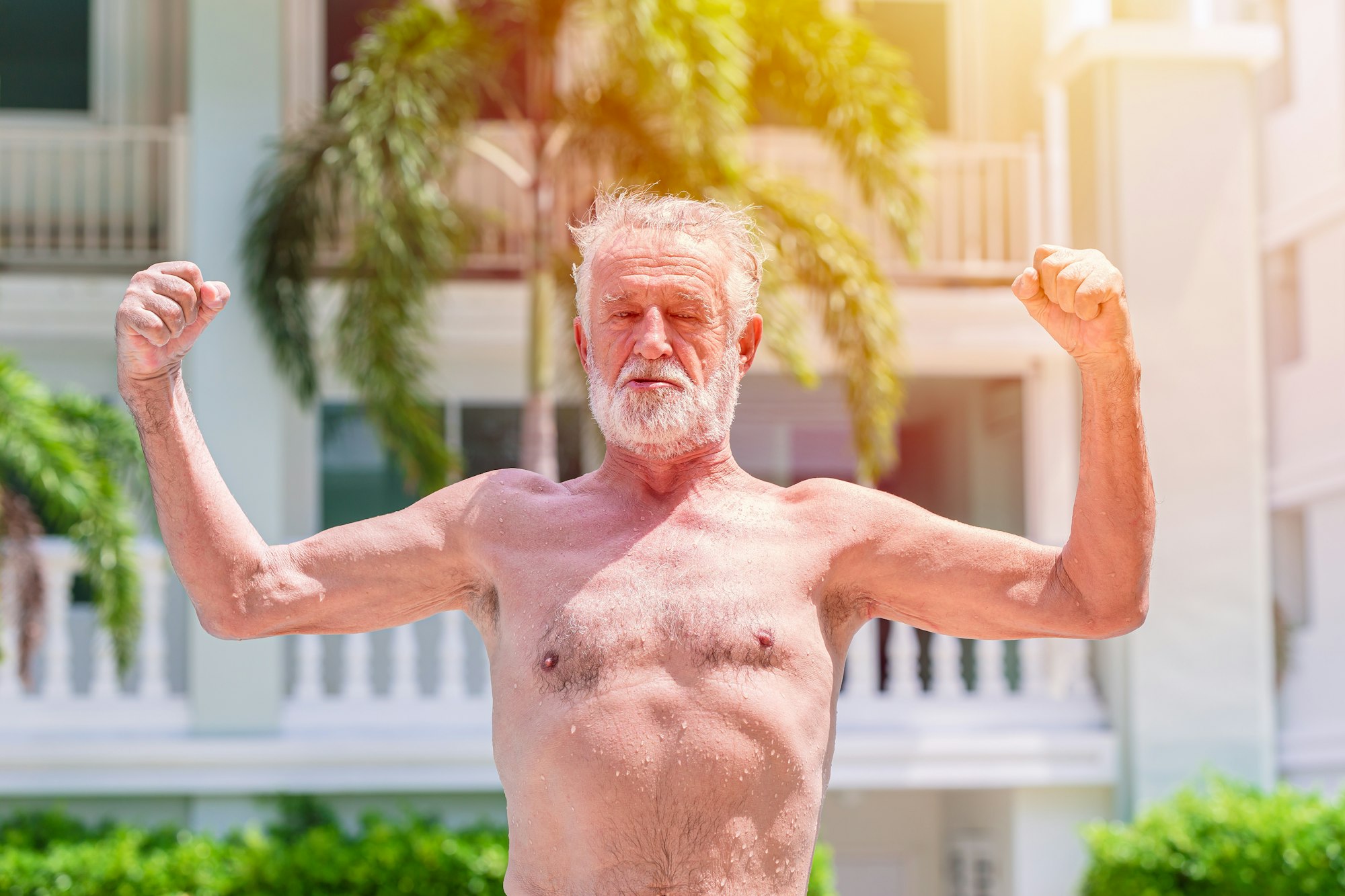 strong healthy elder longlive old man show muscle for sport swimming